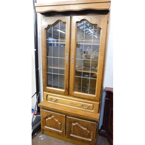 627 - Oak display unit with drawer and leaded glass doors - heavy, approx. 38