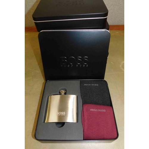 658 - 6x Hugo Boss presentation tins - each contains hip flask and 2x pairs of socks