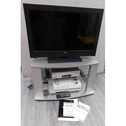 734 - JMB TV with remote and instructions on stand with Goodman VHS and DVD player plus Sky box in W/O