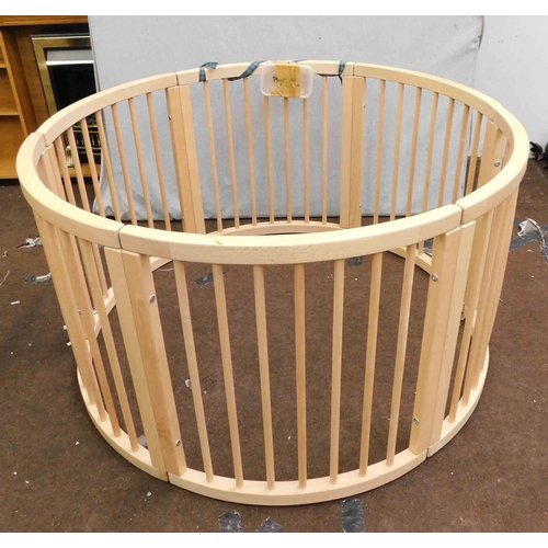 536 - Large circular wooden playpen...