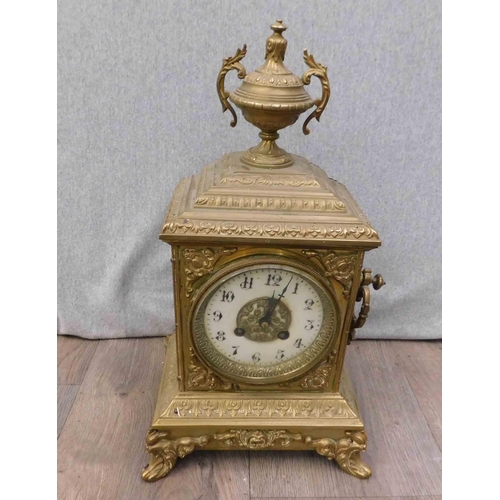 642 - French brass metal clock with enamelled Arabic dial, ornate gilt metal centre dial - needs attention