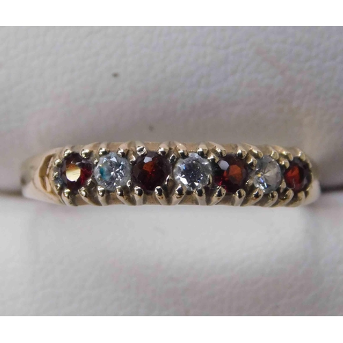 241 - 9ct Gold - garnet & white stone set - 1/2 eternity ring - size P 1/2