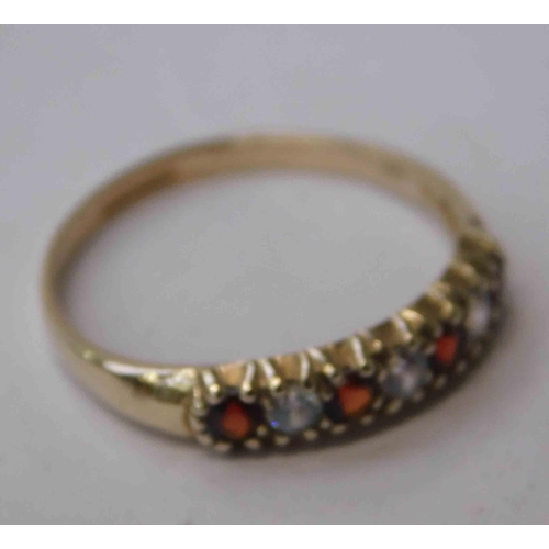 241 - 9ct Gold - garnet & white stone set - 1/2 eternity ring - size P 1/2