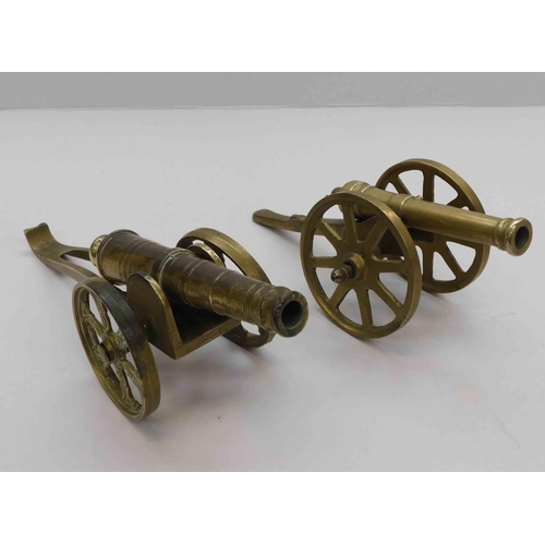 109 - Two - brass desk canons