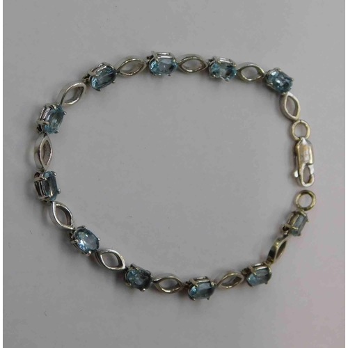 143 - 9ct White gold & aquamarine set bracelet - total combined weight 8.6g