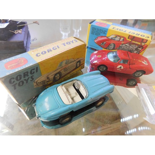 139 - Two - Corgi Toys die cast cars - Mercedes Benz 300SL 303 & Ferrari 250 LeMans 314 - boxed