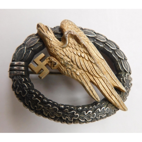 124 - WWII German military style badge & ring