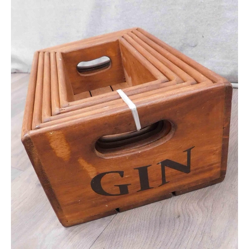 597 - 5x Russian doll style storage boxes labelled Hendrick's gin