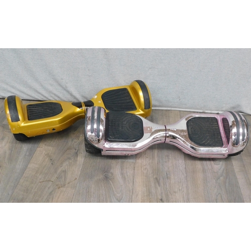 609 - 2x Segway's/hoverboards gold and silver - unchecked