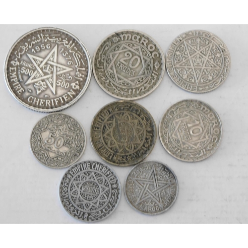 131 - Eight - antique & vintage - Morrocan coins including silver - 1956/500 Franc Mohammed V coin