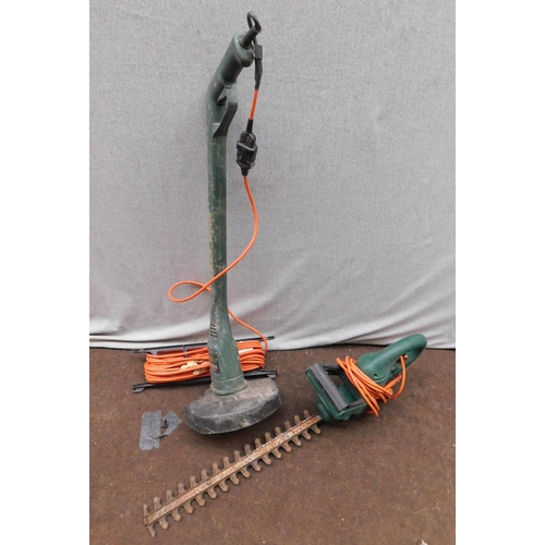 557 - Electric hedge trimmer & strimmer-unchecked