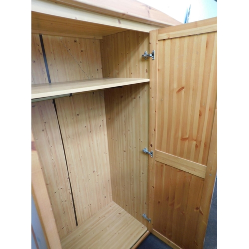 562 - Triple pine wardrobe-double hanging space & single shelves (back panel damaged)