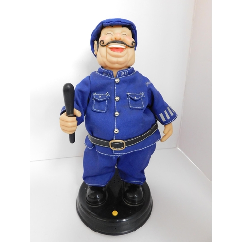 16 - Mechanical - laughing policemen/requires batteries