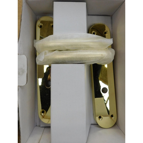 517 - Box of brass door handles...