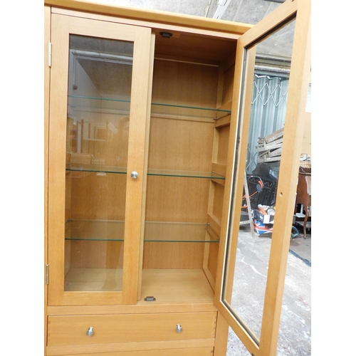 581 - Beech effect display cabinet with 3 drawers + 3 glass shelves