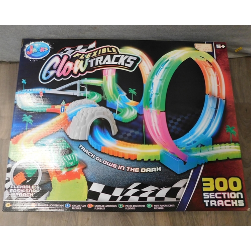 603 - Boxed 300 section flexible glow track car racing set