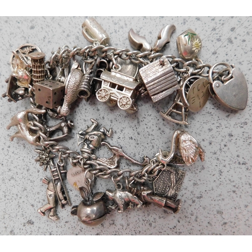 258 - Vintage - sterling silver charm bracelet - with approx 35 charms