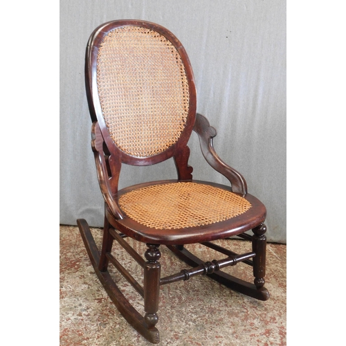 572 - Child's rocking chair, cane seat & back