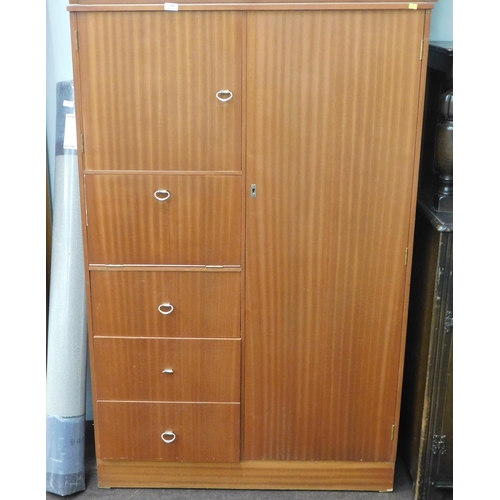 585 - Storage cupboard/wardrobe with drawers with key