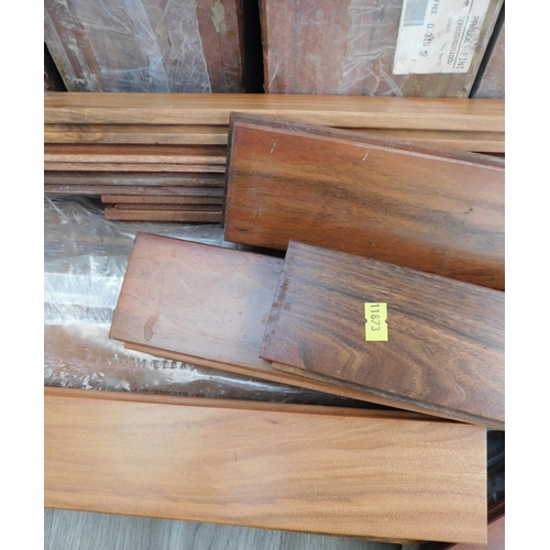 606 - 11 Sealed packs and some loose finished flooring, various lengths - all 7cm wide