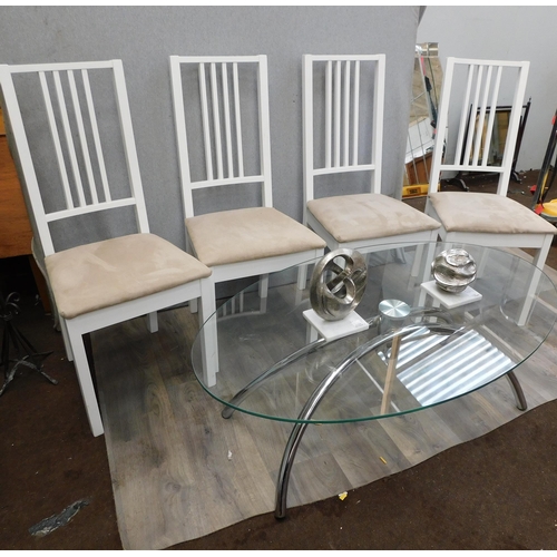 670 - Glass topped coffee table with 4 dining chairs and 2 ornaments