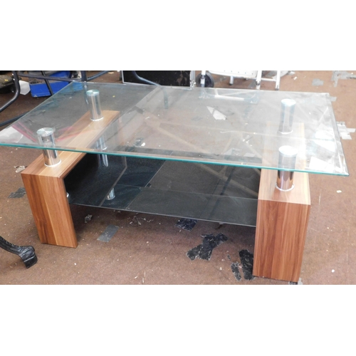 825 - Glass topped coffee table...