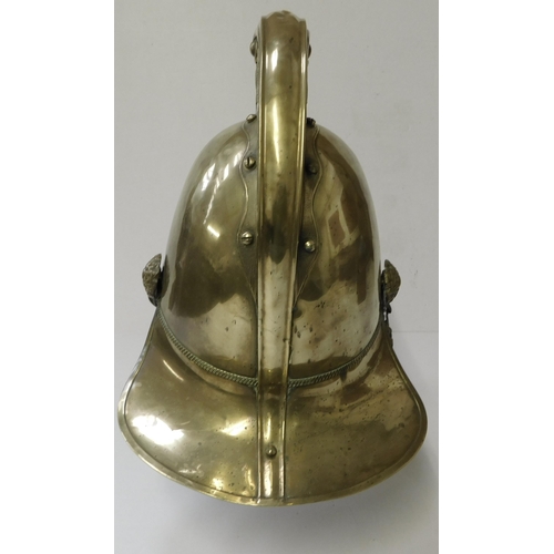 29 - Antique - brass Fireman's helmet - decorated with embossed dragons & crest - with leather liner...