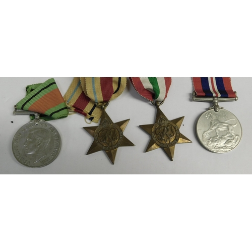 9 - WWII era - British military issue - Four medal group/including Africa & Italy star medals & ribbons