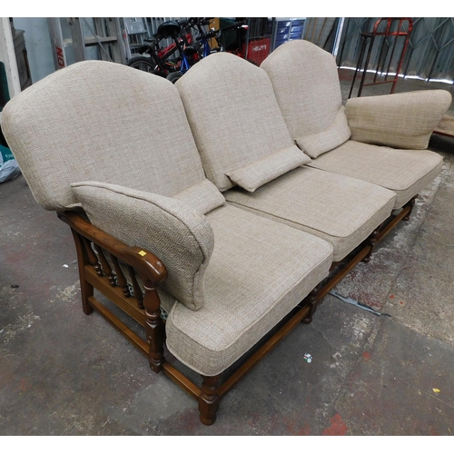 559A - Three seater Ercol settee (slight damage to one arm)