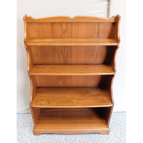 562 - Ercol shelving unit/ plate stand