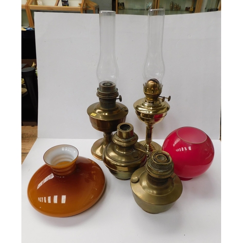 29 - Brass oil lamps - bases & glass shades