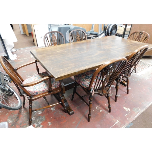 557 - Solid oak table & 6x wheelback chairs