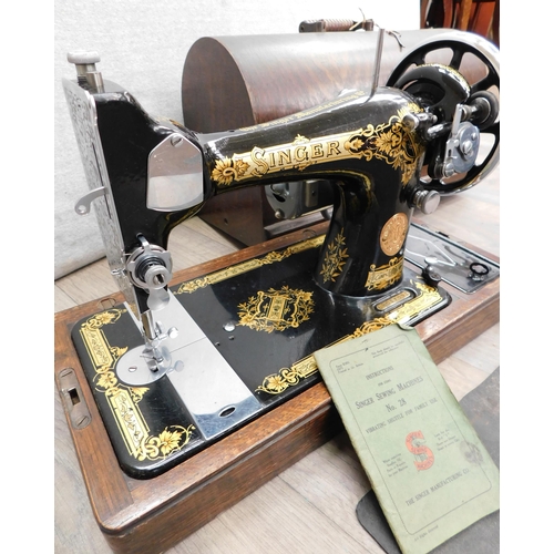 570 - Cased Singer sewing machine-unchecked