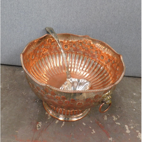 581 - Large copper punch bowl with brass lion handles