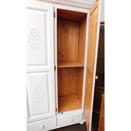 638 - Large painted pine triple wardrobe with drawer section