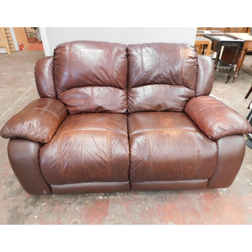 568 - Brown leather reclining two seater settee