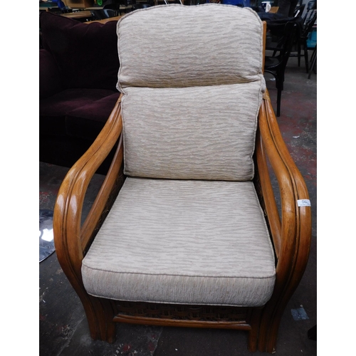 569 - Woven rattan armchair