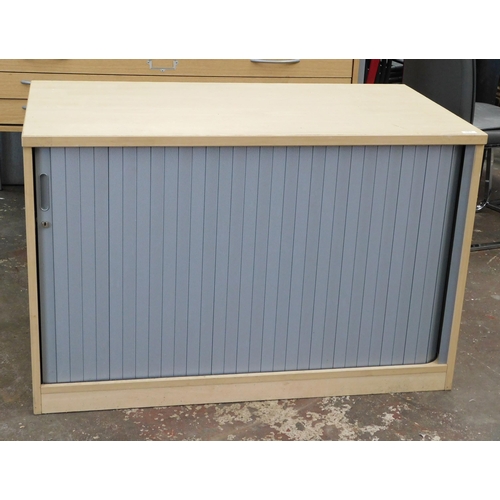 767 - Roller fronted storage cabinet