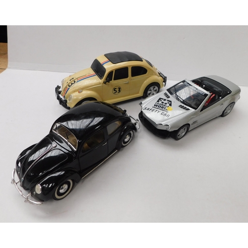 51 - Three - die cast model cars including - Maisto/Volkswagen Beetle