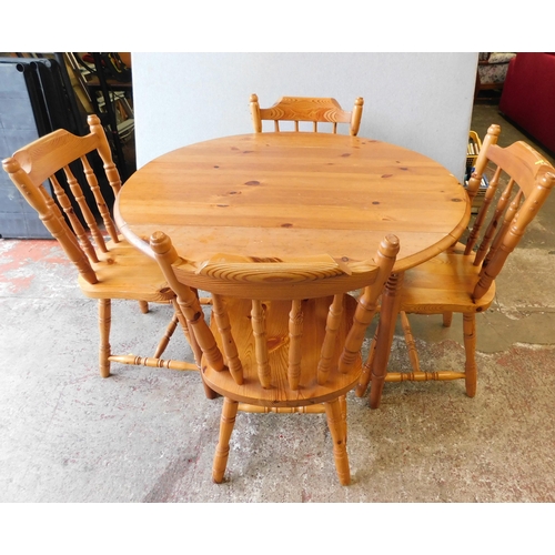 544 - Drop leaf pine table and four pine dining chairs