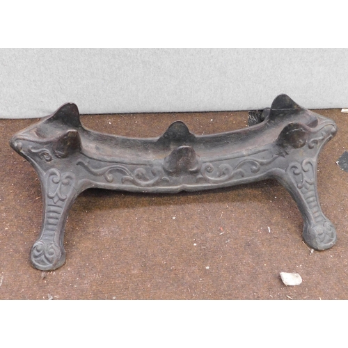 656 - Two antique heavy cast iron bicycle stand