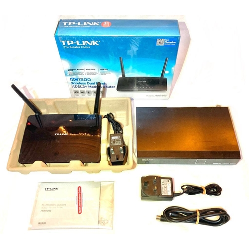 528 - Three items incl. TP-Link wi-fi modem - boxed and Sharp TU-T2 freeview box with remote and Philips  ...