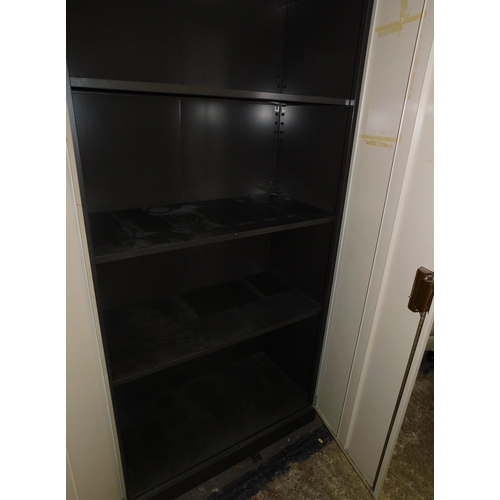 680 - Large metal two door storage cabinet with shelves - as seen