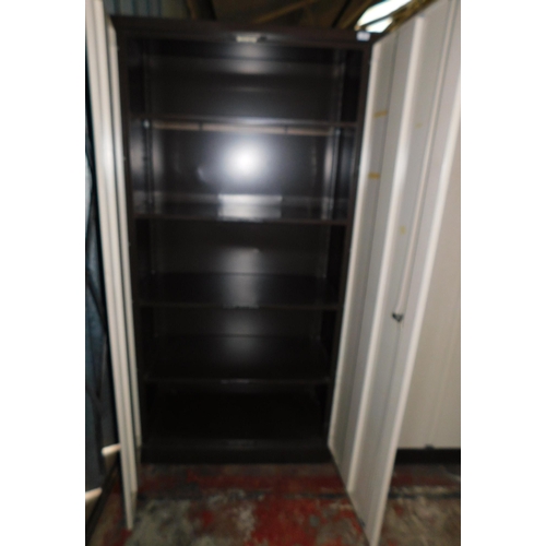 704 - Large metal two door storage cabinet with shelves incl. keys