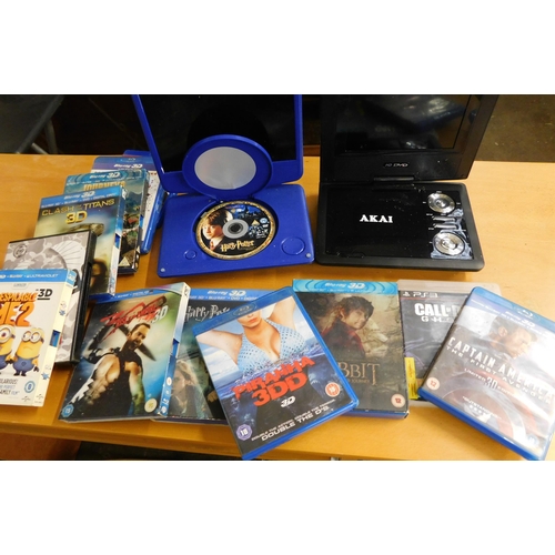 583A - 2 Portable DVD players (unchecked) + selection of DVDs & Blue Rays