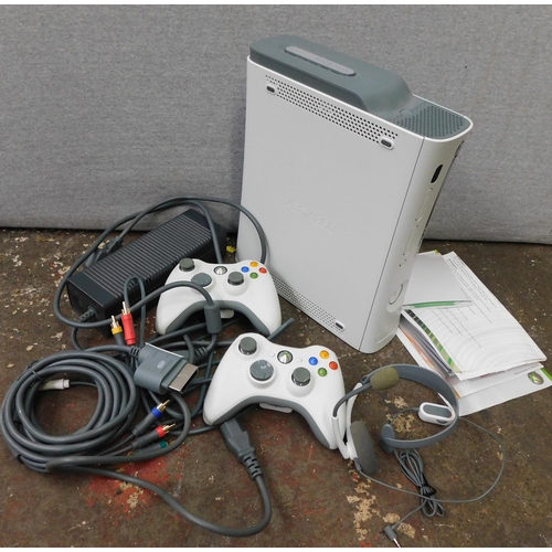 610 - Xbox 360 and two controllers W/O