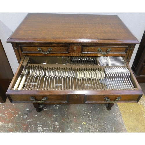 774 - Full canteen of cutlery in oak two drawer cabinet