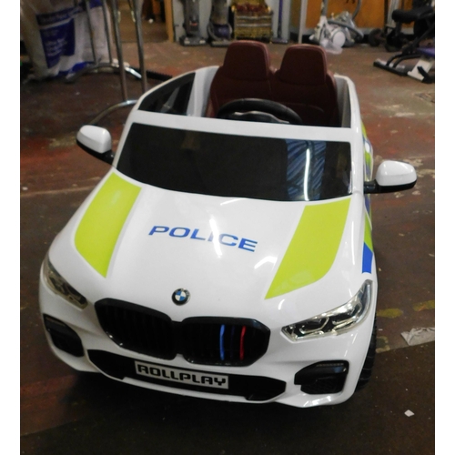 663 - Police BMW ride on car, with charger W/O fully charged