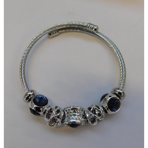 99 - Silver tone - bangle & charms/packaged as new