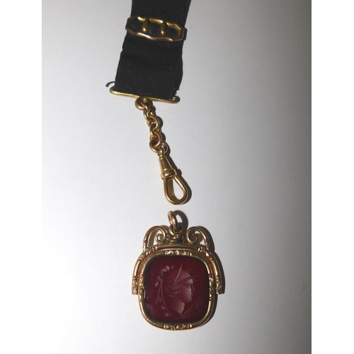 103 - Gold tone - Victorian fob spinner with carved cornelian